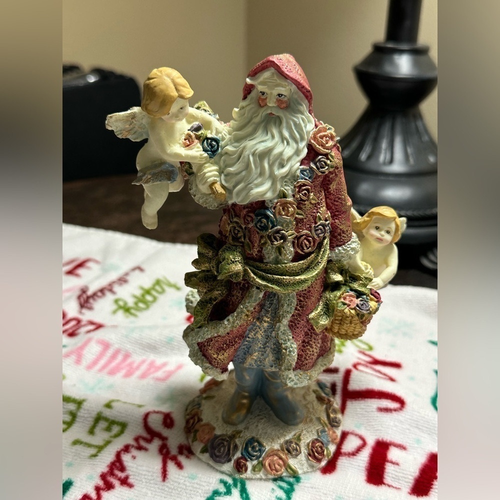 Festive Santa Figurine with Cherubs